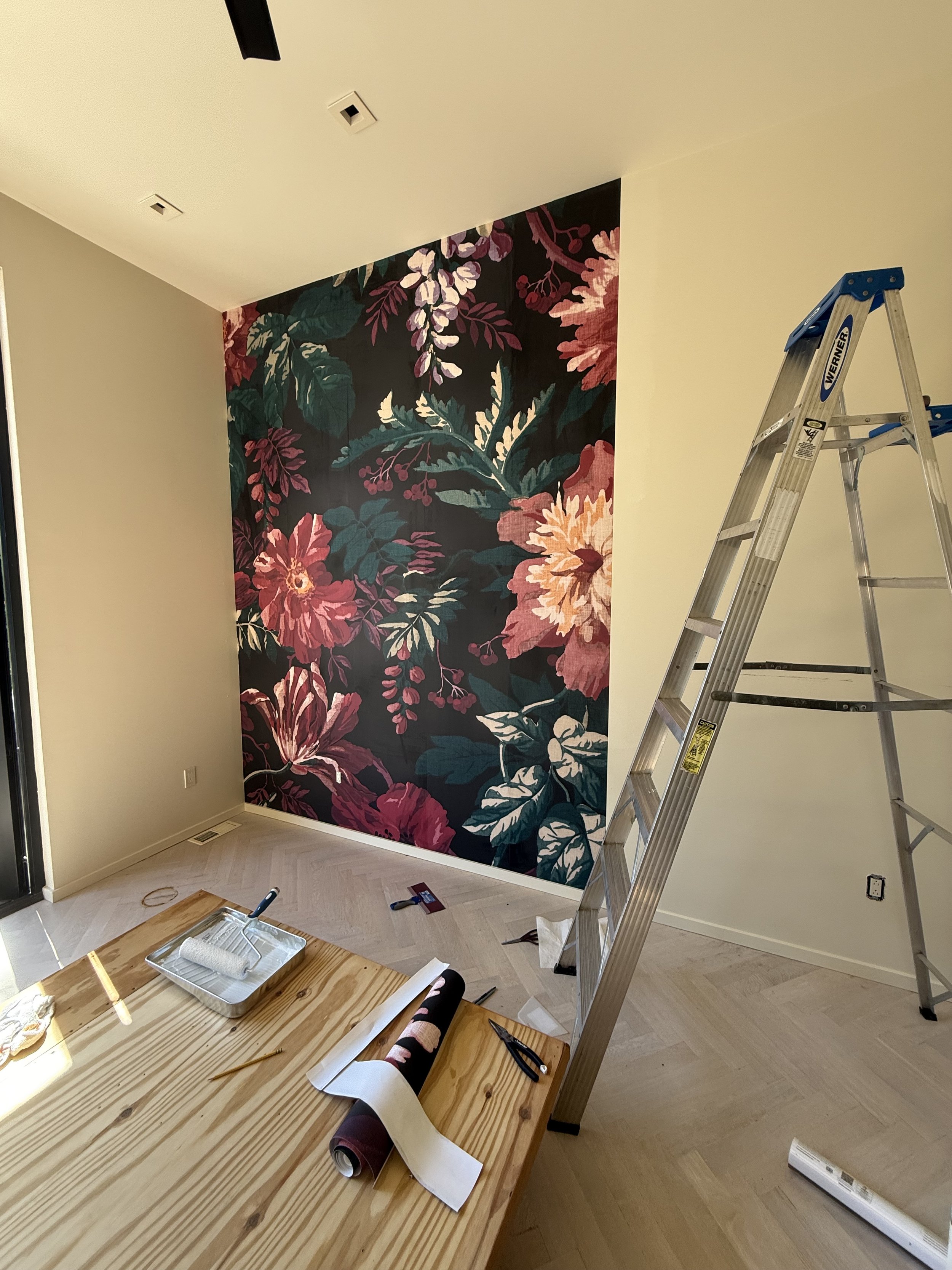 Wallpaper installation detail in a finished interior